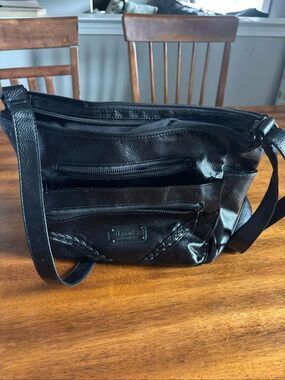 D. Marks women’s purse